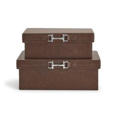 two brown suitcases sitting side by side on top of each other and one has a lock