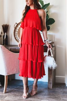 The Bella tiered dress is now back in a bright bold red! Style this beautiful maxi with the pearl belt. Fully Lined High Neck Midi Tired style midi can be styled with belt Pleated tiered Midi Elastic waist band Tie back closure Model is wearing a size Small. She is 5'6". 130lbs. Bust: 34C" Waist 26" Hips 36" Tiered Dresses, Tie Backs, Tiered Dress, Pet Hair, Elastic Waist, High Neck, Red Dress, Dress Up, Boutique