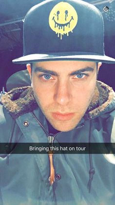 a man wearing a hat with the words bring this hat on tour written below it