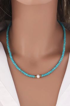 Turquoise & Pearl Necklace Elegantly crafted to exude sophistication and timeless beauty, the Turquoise & Pearl Necklace is a stunning addition to any jewelry collection. This piece seamlessly combines the vibrant allure of turquoise with the classic charm of freshwater pearls, creating a versatile accessory perfect for any occasion. Key Features: Material: High-quality Turquoise and Freshwater Pearls Chain Length: 17.7 inches, ensuring a perfect fit for most necklines Pearl Diameter: 0.6 inches Blue Gemstone Necklace For Beach, Blue Gemstone Jewelry For The Beach, Elegant Turquoise Necklace For Beach, Turquoise Single Strand Jewelry For The Beach, Turquoise Single Strand Jewelry For Beach, Day Care, Pearl Chain, Chain Lengths, Chain Length