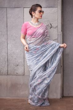 Grey saree highlighted with pearl-sequin embroidery. Comes with blouse.
Component: 2
Embroidered
Sleeve Type: Half
Fabric: Tissue
Color: Grey, Pink - Aza Fashions Transitional Pre-draped Saree With Floral Embroidery, Party Pre-draped Chanderi Saree With Floral Embroidery, Party Wear Embroidered Pre-draped Saree For Festivals, Traditional Organza Pre-draped Sequined Saree, Traditional Sequined Pre-draped Organza Saree, Party Wear Blouse With Dupatta In Tissue Silk, Embroidered Silk Saree For Party Wear, Silk Embroidered Party Wear Saree, Organza Pre-draped Saree With Sequins