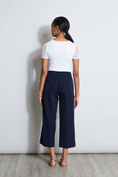 Springs "IT" pant is a chic update to the relaxed wide leg pant. We're obsessed with its cropped length, higher waist silhouette with graphic D-ring belt. Wear it with a knit or layered with a blazer, it will become a favorite in your wardrobe. T-Tahari Crepe Wide Leg Cropped Pant with D-Ring Belt Detail Runs true to Size Model is 5'9" and wearing size 2 Dry Clean Only Imported Style #: THF44003 Chic Cropped Leg Dress Pants For Office, Chic Cropped Leg Dress Pants For Business Casual, Chic Cropped Leg Bottoms For Work, Chic Cropped Leg Bottoms For Business Casual, Chic Cropped Leg Business Casual Bottoms, High Waist Culottes For Work With Elastic Waistband, High-waisted Workwear Culottes With Elastic Waistband, High-waisted Culottes With Elastic Waistband For Work, Chic Wide Leg Culottes For Business Casual