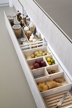 the drawers are organized with food and utensils