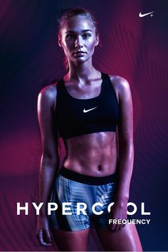 a woman in black top and blue shorts standing next to purple background with the words hypercell