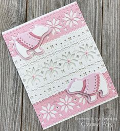 a pink and white card with an elephant on it