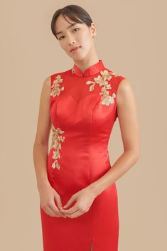 Less is more with this simple, yet elegant sheath qipao. We took the classic cheongsam silhouette and modernized it with delicate floral embroidery, a front slit, and a sheer mesh back. If you’re looking for something modest and classy for your tea ceremony, then look no further. Groom's outfit recommendation: Pair this with our Shang Jacket or Classic Brocade Bowtie. Accessory recommendation: Pair this with our Sunrise Hairpin. This dress is named after Grace Lee Boggs, who was an American auth 00s Wedding Dress, Dress Quizzes, Wedding Dress Film, Chinese Bridal Dress, Red Chinese Wedding Dress, Chinese Wedding Tea Ceremony, Vietnamese Wedding Dress, Wedding Cheongsam, Traditional Chinese Wedding