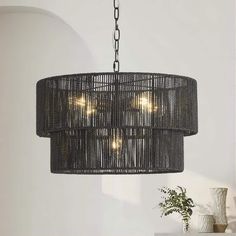 a black chandelier hanging from a ceiling