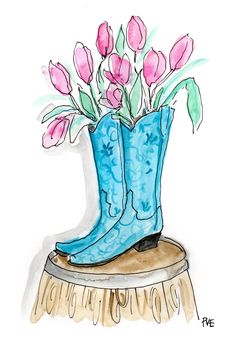 a blue boot with pink flowers in it sitting on top of a wooden stump next to a white wall