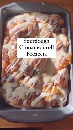 a close up of food in a pan on a table with the words sourdough cinnamon roll focaccia