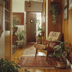 a living room filled with furniture and plants