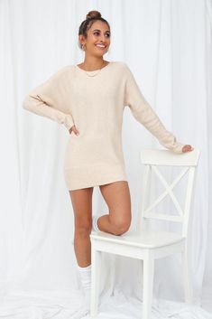 Length from shoulder to hem of size M/L: 75cm. Beige knit jumper. Non-lined. Cold hand wash only. Model is a standard XS and is wearing a size XS. True to size. Stretchy purl knit fabric; soft finish. No zipper. Slip-on style. Plush finish may vary. 80% Acrylis/20% Wool. Lazy Sundays have never been this chic without the Not My Reality Knit Jumper. We admit we're a little bit in love with this jumper's extra comfy oversized silhouette, relaxed shoulders and tapered sleeves. Team with a mini skirt or with some fitted jeans and booties! Cream Sweater With Ribbed Neckline For Winter, Casual Crew Neck Chunky Knit Sweater Dress, Casual Chunky Knit Crew Neck Sweater Dress, Beige Crew Neck Sweater Dress For Winter, Cream Knit Long Sleeve Sweater Dress, Cream Long Sleeve Knit Sweater Dress, Long Sleeve Cream Knit Sweater Dress, Casual Knit Sweater Dress With Crew Neck, Fall Crew Neck Soft Knit Sweater Dress