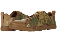 a pair of shoes with camouflage print on them