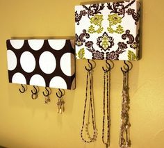 an image of a wall hanging on the side of a yellow wall with two lamps