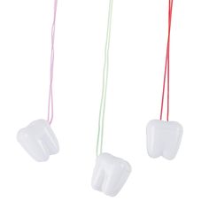 PRICES MAY VARY. These container necklaces are a great incentive to get kids to go to the dentist. You could also use these tooth charms to save one of your child’s baby teeth. 144 tooth necklaces Each 3/4" plastic tooth saver is on a 20" - 20 3/4" cord. Our children’s necklace items contain breakaway features, attachments or materials required by the Consumer Product Safety Commission’s children’s jewelry standard. Great for leaving out for the tooth fairy. Haunted House Party Decorations, House Party Decorations, Luau Decorations, Tooth Charm, Lost Tooth, Haunted House Party, Festival Necklace, Door Prizes, Tooth Necklace