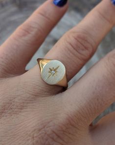 Our solid gold starburst signet ring features a cosmic star set with a sparkling diamond. Choose from 14k, 18k yellow, rose, white gold or platinum. Prefer a colored gemstone in place of the diamond? Just leave us a note at checkout. This ring is a lovely addition to your celestial fine jewelry, and makes a meaningful, timeless (and cool!) gift for your loved ones this holiday season. Details: - Made at our family-run studio in NYC. - Solid 14k, 18k yellow, rose, white gold or platinum -- choose White Gold 14k Signet Ring With Single Cut Diamonds, Celestial Style Diamond Signet Ring In Yellow Gold, Starburst Diamond Jewelry For Anniversary, Classic Star-shaped Jewelry With Single Diamond, Celestial Style Diamond Ring With Single Round Diamond, Luxury Rose Gold Signet Ring With Single Diamond, Celestial Style Round Diamond Ring With Single Diamond, Celestial Gold Signet Ring Stamped 14k, Gold Celestial Signet Ring Stamped 14k