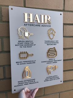 a sign on the side of a building that says hair after care advice and instructions