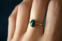 STUNNING handmade Malachite ring set✨ * Listing covers both the malachite ring and twisted band.  Due to each stone being natural, each stone will vary in color, design, and clarity Beautiful 8x6mm natural oval Malachite gemstone ✨ Malachite is a green copper carbonate mineral. It is part of the monolithic crystal system and has a silky luster. Malachite is often used as an ore of copper. It has an opaque transparency and sometimes has a patterned surface. Malachite is a rich shade of green and its meaning is transformation and positive change. This gem was loved by the Greeks and the Egyptians, and used as a protective gem from curses and negative energies.  It is a stone that takes its name from the Greek word for malakos - meaning soft. While it is a stone that holds its strength, Malac Minimalist Jewelry Gold, Gold Minimalist Jewelry, Schmuck Gold, Malachite Ring, Crystal System, Malachite Rings, Twisted Band, Gold Filled Ring, Green Copper