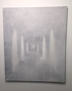 an abstract painting is shown in the middle of a room with white walls and flooring