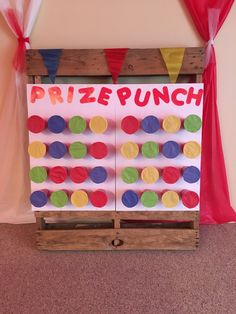 a wooden board with colorful circles on it and the words prize punch written in red