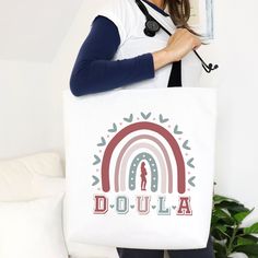 "Celebrate the art of doulas with our stylish \"Doula Tote Bag\" - the perfect gift to express gratitude to these birth professionals. A functional and chic accessory honoring their invaluable contribution to the world of childbirth.  MATCHING SHIRT: https://www.etsy.com/listing/1609787834/doula-shirt-doula-gift-midwife-shirt?click_key=ed9a2c25b5ddc34cdd2df8c39bea3dded4e09d34%3A1609787834&click_sum=4c17cc46&ref=shop_home_active_1 Handmade Design is printed on both sides.  This practical, high-quality Tote Bag is available in three sizes. All-over print provides comfort with style at the beach or out in town. Made from reliable materials, lasting for seasons. 100% Polyester: Extremely strong and durable synthetic fabric that retains its shape and dries quickly  Reinforced stitching on handl White Canvas Bag With Removable Pouch As A Gift, Personalized Multicolor Bags For Everyday, Personalized Multicolor Bags For Everyday Use, Multicolor Personalized Bags For Everyday Use, Everyday Personalized Multicolor Bags, Personalized Gift White Bag, Personalized Multicolor Bags As Gifts, Personalized Multicolor Bags For Gifts, Multicolor Personalized Bags For Gift