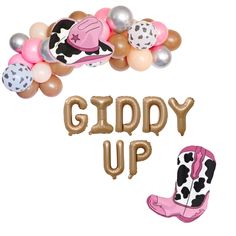 the balloon letters giddy up and cowboy boots are next to each other