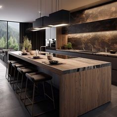 a modern kitchen with an island counter and bar stools