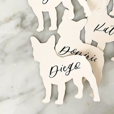 four wooden cutouts with dogs on them that say, i love you and be mine