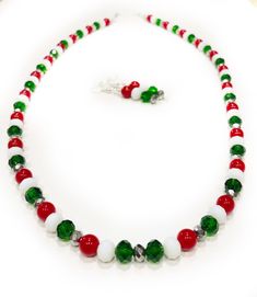 Small glass beaded red and green necklaces for women is simple and beautiful! This beaded necklace will easily become one of your favorite Christmas jewelry pieces.  Christmas Necklace * Festive holiday jewelry! * Very lightweight * Colorful red and green beads * 24.5 total inches, end to end * 1 inch extender * Includes 2" earrings * Silver lobster clasp closure * Made with heavy duty beading wire * Crimped to secure beads in place * Wire guards used to prevent breakage  Necklaces are READY TO Multicolor Round Beads Christmas Jewelry, Christmas Beaded Necklaces With Colorful Beads For Gift, Christmas Gift Beaded Necklaces With Colorful Beads, Christmas Gift Beaded Necklaces With Round Beads, Christmas Gift Colorful Beaded Necklaces, Christmas Necklaces With Colorful Round Beads, Christmas Necklaces With Colorful Beads, Christmas Necklace With Colorful Round Beads, Christmas Holiday Necklace With Round Beads