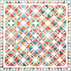 a quilt made with colorful triangles on the front and back, all in different colors