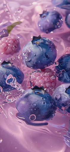 blueberries and raspberries are in the water with bubbles on it's surface