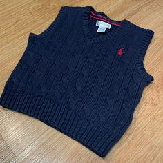 Brand New! Navy Blue Sweater Vest With Red Stitched Logo. Blue Winter Tops For Playwear, Blue Tops For Playwear In Winter, Blue Winter Playwear Tops, Blue Cotton Sweater Vest For Winter, Navy Cotton Sweater Vest For Winter, Ralph Lauren Cotton Winter Tops, Fitted Knit Sweater Vest In Blue, Ralph Lauren Blue Winter Tops, Navy Blue Sweater Vest