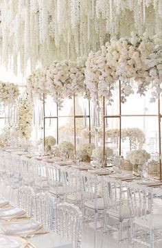 an instagram page with tables and chairs decorated in white flowers