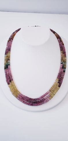 Tourmalines are given a center stage to turn on their full-color show. From dark greens to yellows and pinks, tourmaline has it all. The 3 strands multicolor necklace is eager to transmit to you this gemstones' qualities: tourmaline attracts inspiration, compassion, tolerance, and prosperity. *Natural Multi Tourmaline Rondelle Faceted Beads, *Stones: Watermelon Tourmaline *Clasp: Surgical steel *End to end Length: 18 Inches *Bead Size: 3.5-3.8 mm approx. *Carat wt.: 204.58Ct FREE Shipping and Gi Multicolor Tourmaline Multi-stone Necklace, Multicolor Multi-stone Tourmaline Necklaces, Multicolor Multi-stone Tourmaline Necklace, Multicolor Tourmaline Faceted Beads Necklace, Multicolor Tourmaline Beaded Necklace With Faceted Beads, Multicolor Tourmaline Gemstone Beads Necklaces, Multicolor Tourmaline Gemstones In Round Shape, Multicolor Faceted Tourmaline Necklaces, Multicolor Round Tourmaline Gemstones