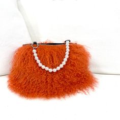 DESCRIPTION:Make a statement and get noticed with our new Fiona Handbag! Unique genuine fur bracelet handbag with pearl handle. Carry on your arm for hands free or hold in your hand. Fully lined with inner pocket. Fun and versatile to dress up a sleek black dress or dress down w jeans and a simple t-shirt; completing your look on an afternoon or night out - even at a wedding! Holds a cell, money, credit cards, glasses, lipstick, keys. • Genuine Italian short fur, Olive Sheepskin or long curly Mo Chic Evening Shoulder Bag For Winter, Chic Evening Bags For Winter, Elegant Winter Evening Bags, Elegant Evening Bags For Winter, Chic Rectangular Bag With Faux Fur Trim, Elegant Faux Fur Bags For Winter, Chic Formal Bags With Feather Trim, Luxury Evening Bags In Faux Fur, Fur Handbag