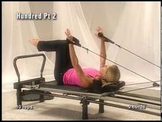 a woman doing exercises on a rowing machine