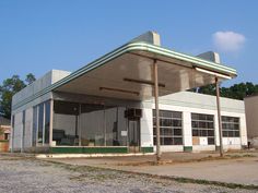 an old gas station sits empty in the middle of nowhere