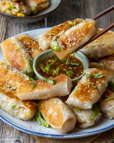 an easy crispy rice dumpling recipe with chopsticks and dipping sauce on the side