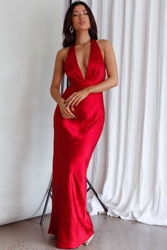 Red, satin dress Bust lined Halterneck style Boning in bodice Satin rose feature in back Zipper in side Can we take a moment for this dress? Our Of Your Dreams dress is sure to make jaws drop! We are obsessed with its satin rose embellishment in the back and classic halter silhouette. Perfect for any occasion where you really need to leave a lasting impression. Team it with clear heels and a satin clutch and watch heads turn. MODEL INFO Model is wearing size XS Height: 5'2" Bust: 33.5" Waist: 25 Red Formal Dresses, Red Satin Dress, Satin Clutch, Red Homecoming Dresses, Gown Prom, Ball Gowns Prom, Clear Heels, Date Night Dresses, Prom Dresses Ball Gown