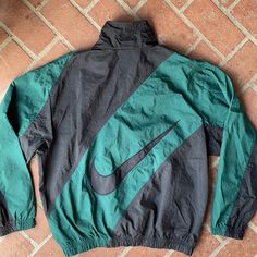 Rare Nike Jacket Hard To Find. Zipper Pockets On Each Side. Green & Black. Great Vintage Piece. Great Condition. The Only Flaw Is The Zipper Tab Is Cut. (See Pic) Still Works Tho. Retro Black Track Jacket With Pockets, Vintage Black Track Jacket With Pockets, Black Vintage Track Jacket With Pockets, Green Nike Windbreaker With Pockets, Nike Green Windbreaker With Pockets, Nike Green Long Sleeve Windbreaker, Black Vintage Track Jacket For Fall, Nike Vintage Long Sleeve Outerwear, Nike Green Track Jacket For Fall