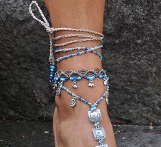 This listing is for one anklet. Beautiful macrame anklet. You can wear it alone or in combination with the barefoot sandals available in my shop (picture 2 and 3 or picture 6 and 7) https://www.etsy.com/listing/503445491/tree-of-life-barefoot-sandals-blue-foot?ga_search_query=tree+of+life&ref=shop_items_search_14 https://www.etsy.com/listing/509419936/beige-and-turquoise-barefoot-sandals?ga_search_query=beige&ref=shop_items_search_2 This anklet is made with waxed polyester cord, tibetan Handmade Adjustable Anklets With Ankle Strap, Adjustable Strand Anklets For Festival, Adjustable Handmade Anklets, Blue Strand Anklets For Festivals, Blue Beaded Bohemian Anklets, Adjustable Toe Ring Bracelets For Beach, Blue Ankle Wrap Anklets For Festival, Blue Bohemian Ankle Wrap Anklet, Bohemian Blue Beaded Anklets