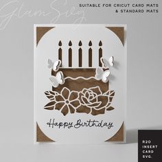 a card with a birthday cake on it and candles in the shape of flowers is shown