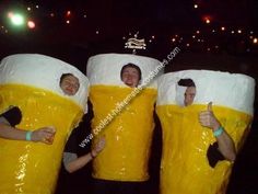 three people in yellow plastic bags with thumbs up and one person wearing a beer mug costume