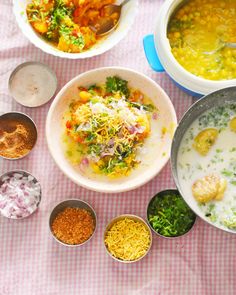 several bowls of food are sitting on a table