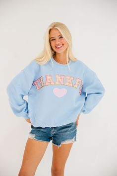 Wrap yourself in gratitude with our Thankful Blue Pullover! This playful pullover features a pastel plaid design and bold Thankful letters, along with a cute pink heart patch. Be cozy and stylish while showing your appreciation! All orders are currently shipping within 14 business days. To receive item quicker, expedited shipping is available at checkout. **ALL THANKSGIVING ORDERS MUST BE PLACED WITH EXPEDITED SHIPPING TO GUARANTEE DELIVERY BY NOV. 27 IF PLACED AFTER NOV. 15** Light Blue Letter Print Sweatshirt For Fall, Trendy Light Blue Fall Sweatshirt, Trendy Light Blue Sweatshirt For Fall, Blue Playful Fall Sweatshirt, Playful Blue Fall Sweatshirt, Playful Blue Sweatshirt For Fall, Cute Blue Sweatshirt With Relaxed Fit, Cute Pink Heart, Pastel Plaid