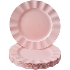 pink plates stacked on top of each other