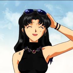 a woman with black hair and sunglasses on top of her head, looking at the sky