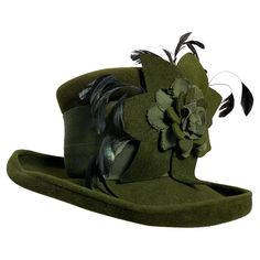 Maison Michel Autumn/Winter Medium Turned-Up Brim Olive Green Felt Beautifully Blocked High Top Hat with Matching Flower, Feathers and Wide Grosgrain Band: Unlabeled, with attached combs for securing. Size 7 Medium. Made in France. Please visit our 1stDibs Store for many more options from the same collection. Green Hats, Steampunk Fashion, Top Hat, Hat Fashion, Made In France, High Top, Olive Green, Accessories Hats, Fall Winter