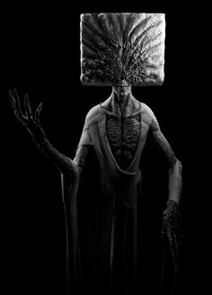 a black and white photo of a man with an object on his head in the dark