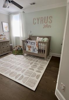 a baby's room with a crib, dresser and bed in the corner