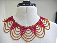 This beautiful beaded African choker/necklace was given to me in 1991 as a gift; it was made and bought in South Africa several years earlier. The exquisite workmanship and stunning colour of this necklace is what makes it so special. The necklace fastens with velcro tabs. It is in as new condition; it's just something that I don't wear because it doesn't suit me. It measures 20 inches (51cm) when stretched out flat. Handmade Red Vintage Choker, Handmade Red Retro Beaded Necklaces, Handmade Retro Red Beaded Necklaces, Handmade Red Beaded Retro Necklace, Red Necklaces With Bead Caps, Red Beaded Chain Choker Necklace, Handmade Vintage Red Beaded Necklace, Retro Red Beaded Necklace, African Choker